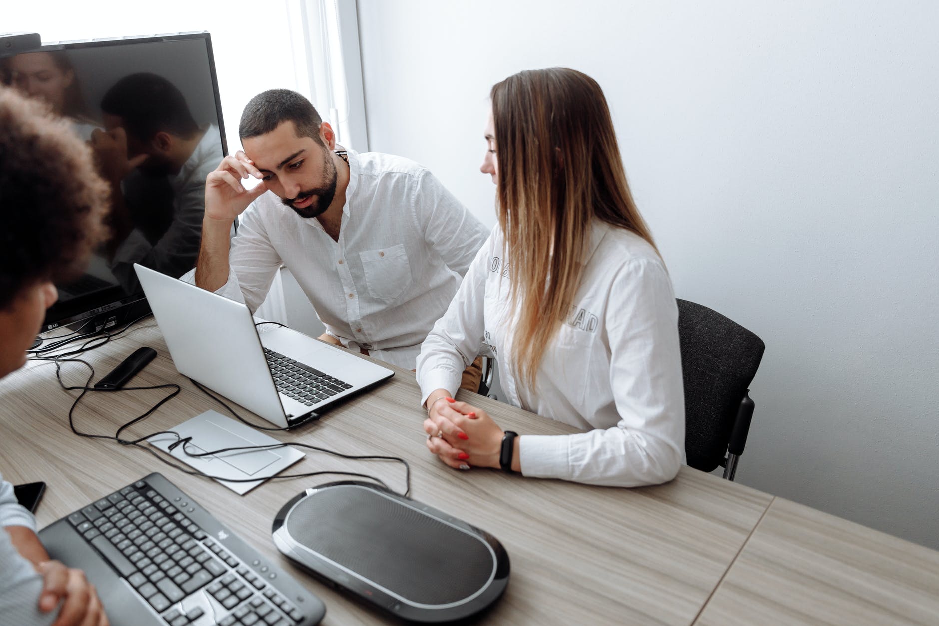 stresses man looking at a laptop