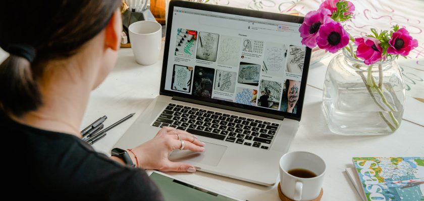 photo of person using laptop for graphic designs