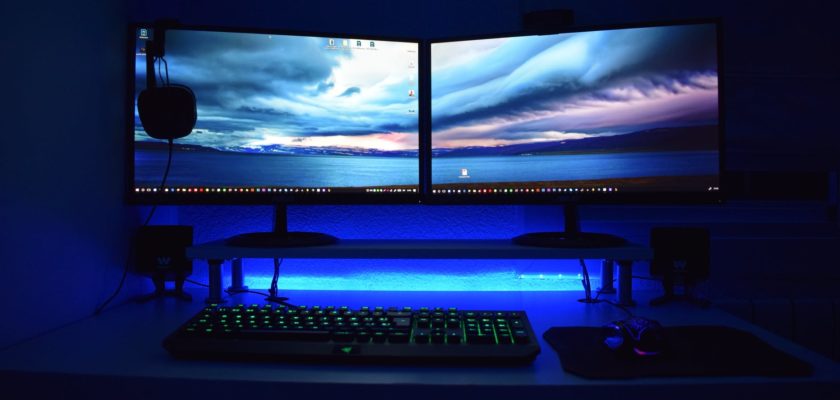 two computer flat screen monitors turned on