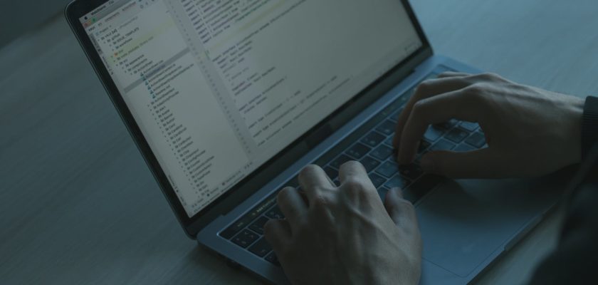 hands on a laptop keyboard