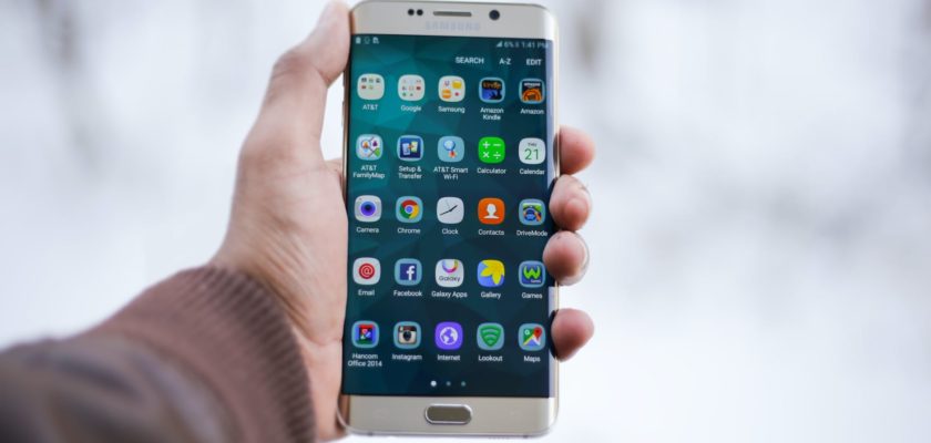 person holding silver android smartphone