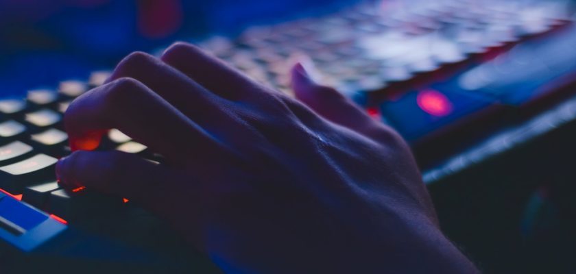 photo of person typing on computer keyboard