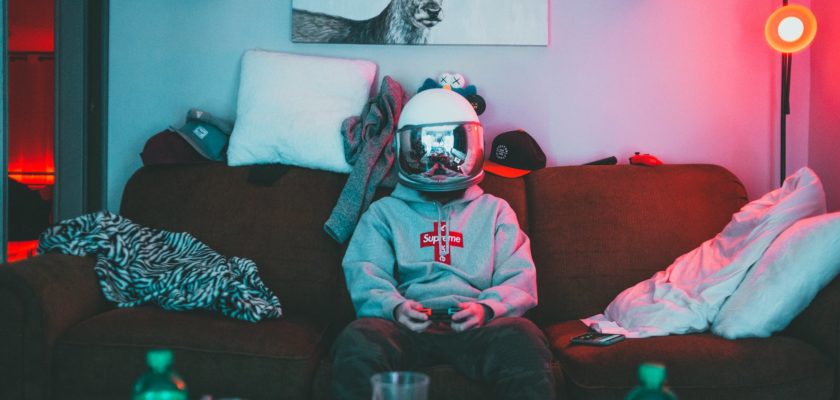 boy in virtual reality helmet playing joystick